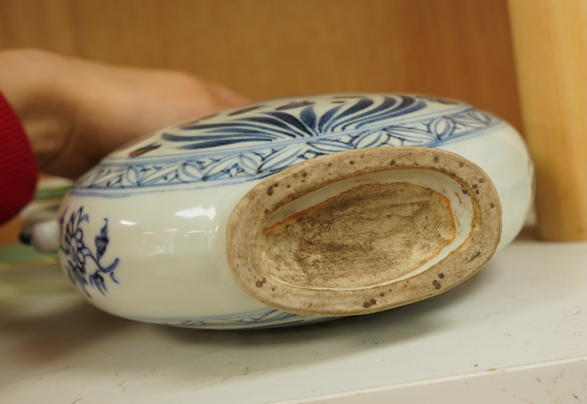 A Chinese blue and white moon flask wine pot with phoenix spout, 21cm high
